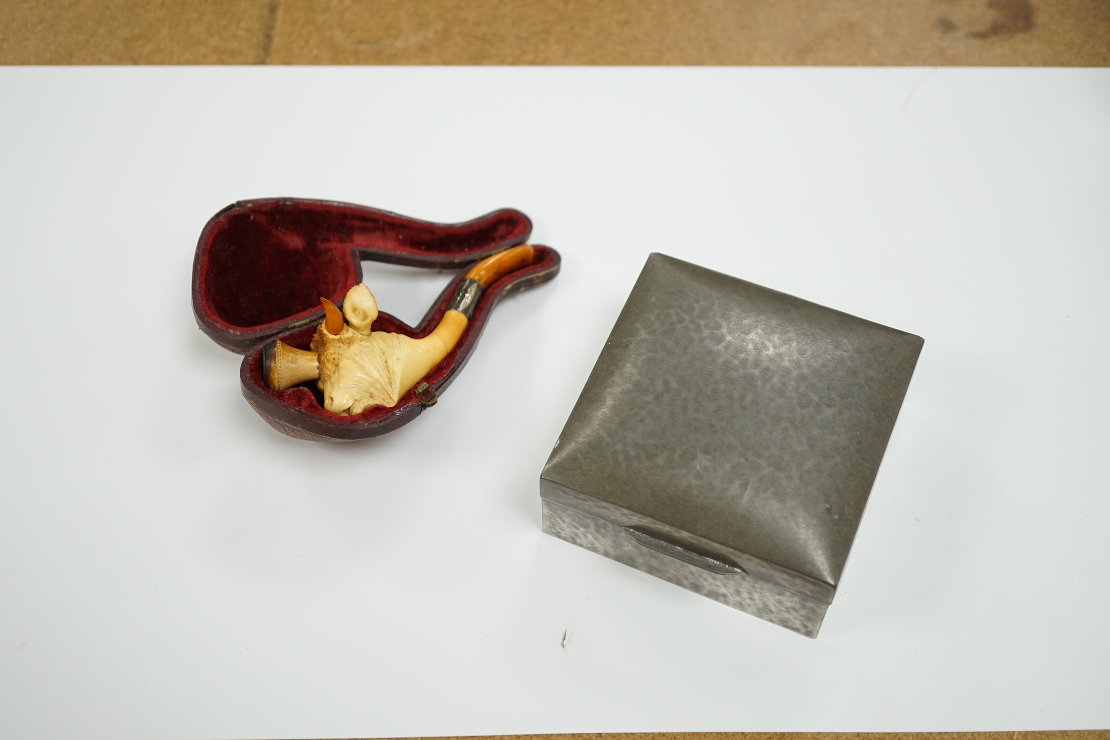 A cased Meerschaum pipe in the form of a bull and a Tudric pewter box, 9 x 9 x 5cm
